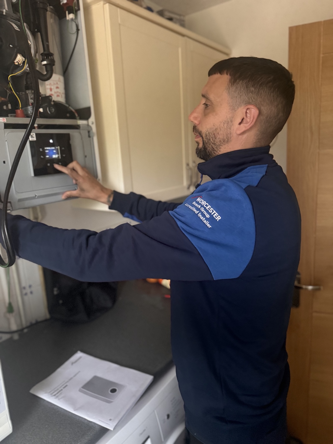 SMC engineer inspecting a Worcester Bosch boiler