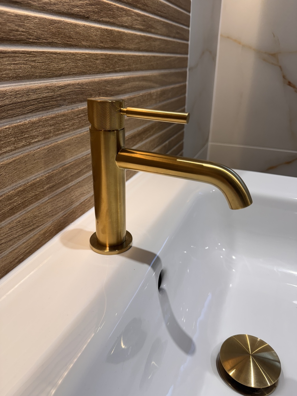 Close-up of brushed brass basin tap