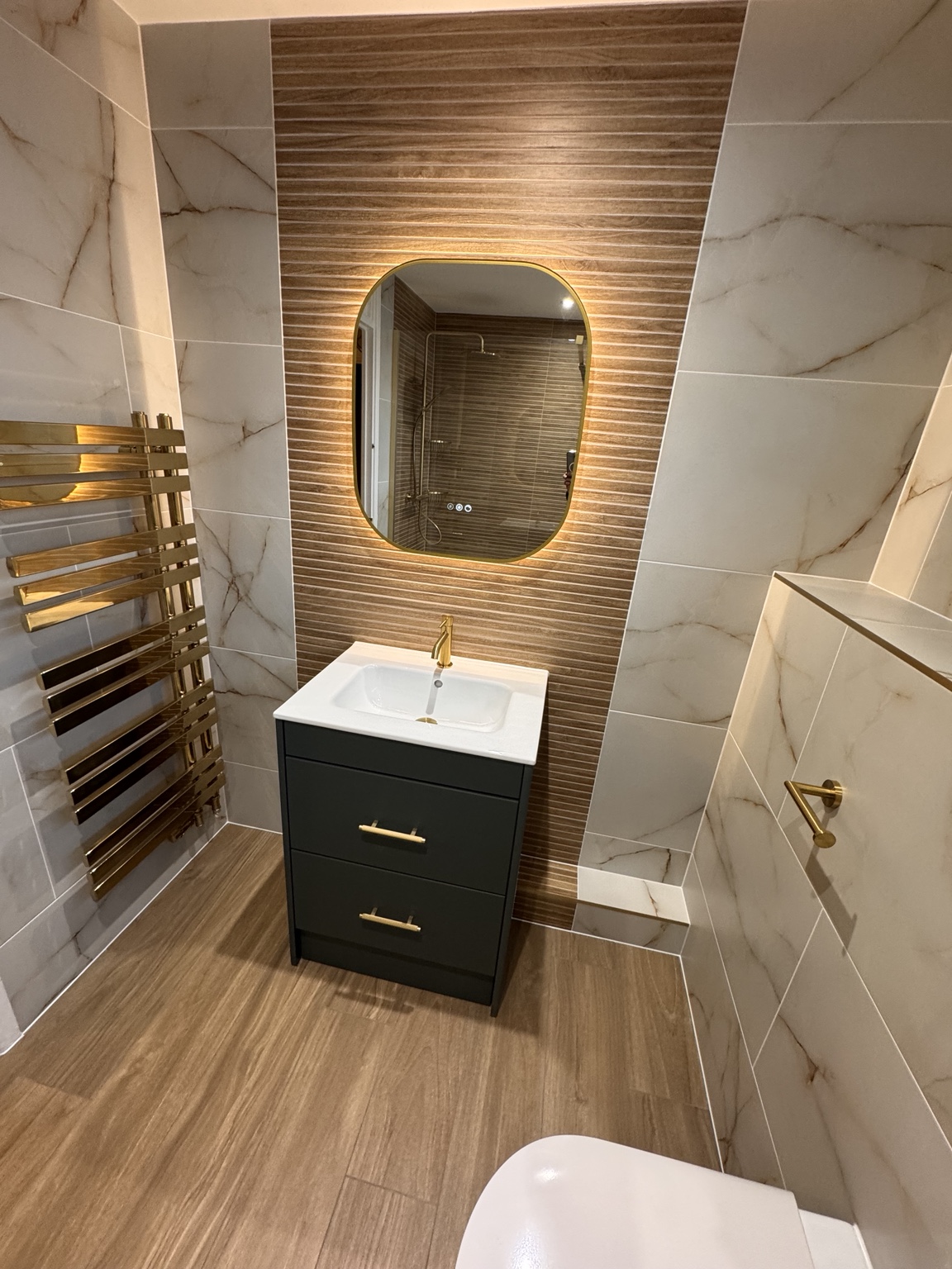 Calypso vanity with brass tap and illuminated mirror